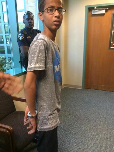 Ahmed Mohamed in cuffs for building a clock