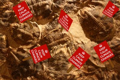 Trilobite Climate Deniers: Photo of trilobite fossils with protest signs added, reading “Keep Calm, Climate Changes"