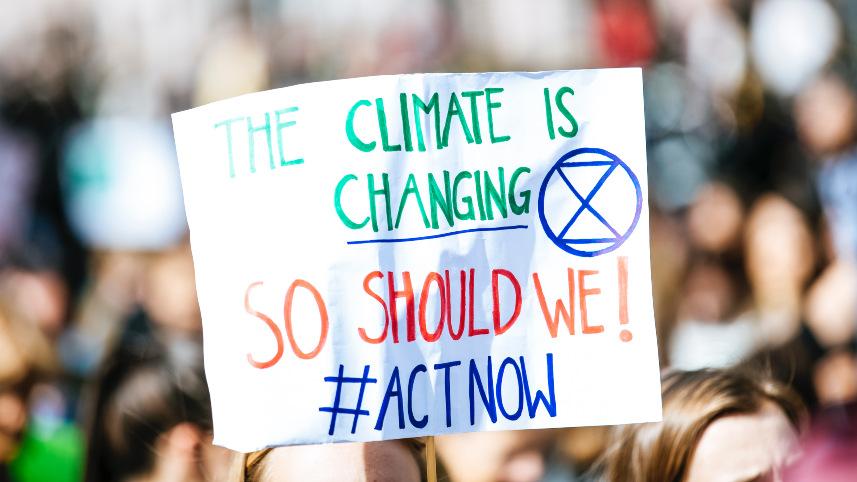 Climate activist holding a sign.