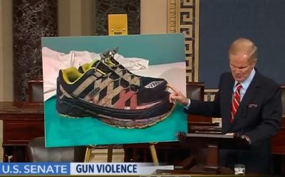 Senator Nelson shows the bloodsoaked shoes of a trauma surgeon who treated victims from the Pulse nightclub shooting